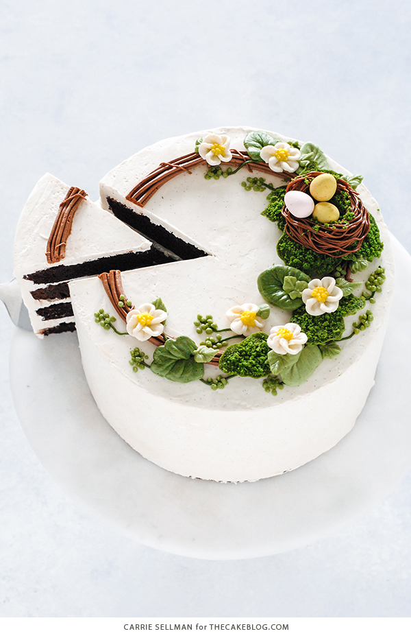 Spring Wreath Cake - how to make a buttercream wreath cake a bird's nest, cherry blossoms, green berries and cookie moss | by Carrie Sellman for TheCakeBlog.com #easter #easterdinnerideas #mothersday #cake