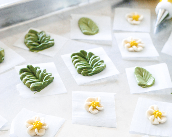 Spring Wreath Cake - how to make a buttercream wreath cake a bird's nest, cherry blossoms, green berries and cookie moss | by Carrie Sellman for TheCakeBlog.com #easter #easterdinnerideas #mothersday #cake