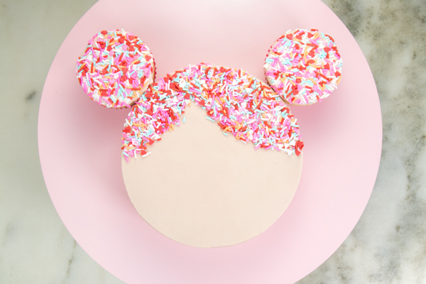 Sprinkle Girl Cake - how to make cute girly face cakes with sprinkles for the hair and chocolate heart sunglasses | by Erin Gardner for TheCakeBlog.com