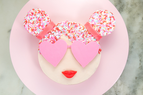 Sprinkle Girl Cake - how to make cute girly face cakes with sprinkles for the hair and chocolate heart sunglasses | by Erin Gardner for TheCakeBlog.com