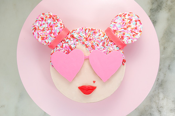 Sprinkle Girl Cake - how to make cute girly face cakes with sprinkles for the hair and chocolate heart sunglasses | by Erin Gardner for TheCakeBlog.com