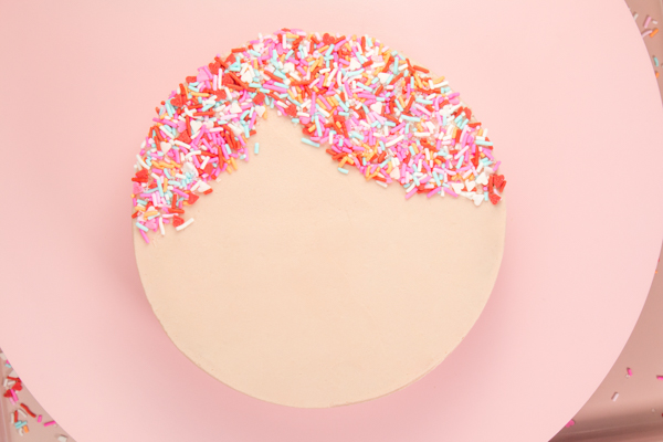 Sprinkle Girl Cake - how to make cute girly face cakes with sprinkles for the hair and chocolate heart sunglasses | by Erin Gardner for TheCakeBlog.com