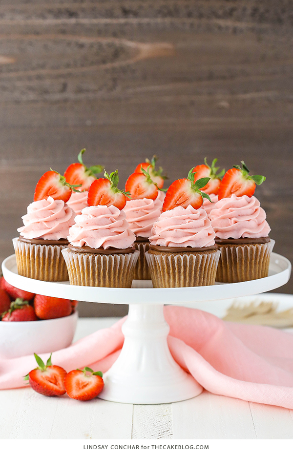 Strawberry Nutella Cupcakes with a soft, fluffy Nutella cupcake topped with more Nutella and a fresh strawberry frosting | by Lindsay Conchar for TheCakeBlog.com