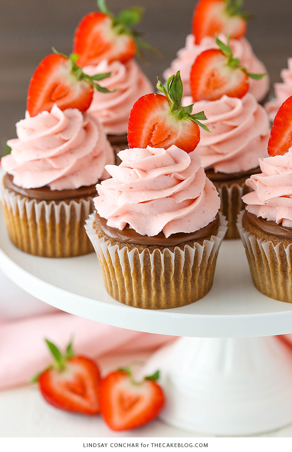 Strawberry Nutella Cupcakes with a soft, fluffy Nutella cupcake topped with more Nutella and a fresh strawberry frosting | by Lindsay Conchar for TheCakeBlog.com