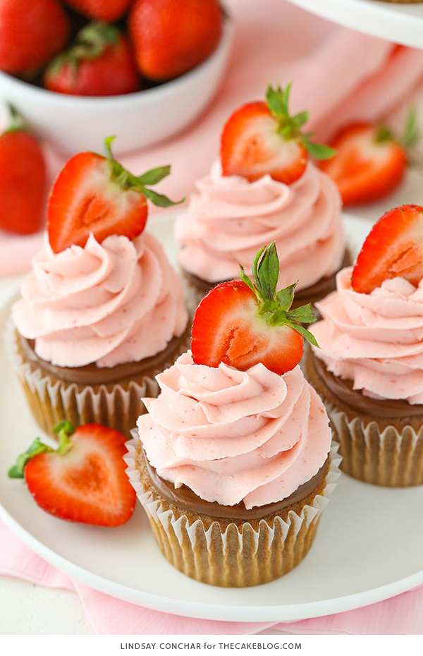 Strawberry Nutella Cupcakes with a soft, fluffy Nutella cupcake topped with more Nutella and a fresh strawberry frosting | by Lindsay Conchar for TheCakeBlog.com