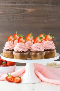 Strawberry Nutella Cupcakes with a soft, fluffy Nutella cupcake topped with more Nutella and a fresh strawberry frosting | by Lindsay Conchar for TheCakeBlog.com