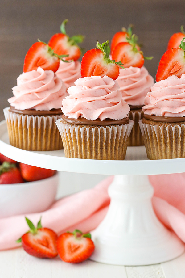 Strawberry Nutella Cupcakes with a soft, fluffy Nutella cupcake topped with more Nutella and a fresh strawberry frosting | by Lindsay Conchar for TheCakeBlog.com