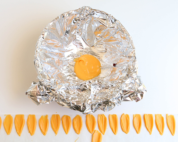 Sunflower Cake - how to make gorgeous sunflower cake decorations using melted chocolate | by Erin Gardner for TheCakeBlog.com