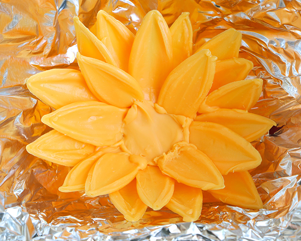 Sunflower Cake - how to make gorgeous sunflower cake decorations using melted chocolate | by Erin Gardner for TheCakeBlog.com