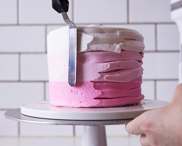 XOXO Valentine's Day Cake - how to make a pink ombre striped cake decorated with chocolate lips, hearts and an XOXO topper | by Cakegirls for TheCakeBlog.com